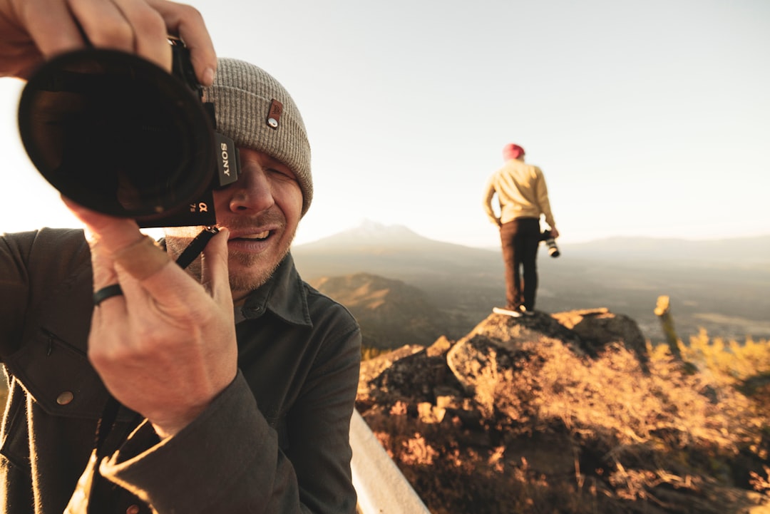 a man taking a picture with his cell phone